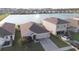 Aerial view of home, showcasing the water view and large backyard at 7771 Davie Ray Dr, Zephyrhills, FL 33540