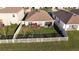 Aerial view of fenced backyard with garden and patio at 7771 Davie Ray Dr, Zephyrhills, FL 33540