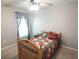 Comfortable bedroom with natural light and a cozy bed at 7771 Davie Ray Dr, Zephyrhills, FL 33540