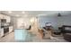 View of living room with kitchen at 7771 Davie Ray Dr, Zephyrhills, FL 33540