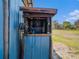 Outdoor air compressor with mounted hose, providing convenient access for maintenance and projects at 7843 Shoupe Rd, Plant City, FL 33565
