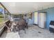 Covered back porch, perfect for outdoor seating and entertaining, with storage at 7843 Shoupe Rd, Plant City, FL 33565