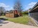 View of the wooden play set on the grassy lawn at 7843 Shoupe Rd, Plant City, FL 33565