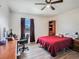 Inviting bedroom with a comfortable bed, a desk, a closet and natural light, perfect for relaxation or work at 7843 Shoupe Rd, Plant City, FL 33565