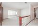 Bright living room featuring neutral carpet and decorative glass block details at 806 Greenbriar Dr, Brandon, FL 33511