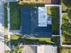 Aerial view of the house showcasing its roof and surrounding greenery at 811 Helmsman Way, Palm Harbor, FL 34685