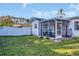 Relaxing screened-in porch and fenced yard offer the perfect outdoor space for this lovely home at 811 Helmsman Way, Palm Harbor, FL 34685