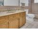 Functional bathroom featuring a vanity with a marble countertop, a toilet, and a tub at 811 Helmsman Way, Palm Harbor, FL 34685