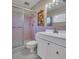Bathroom featuring a shower, vanity, and tile accents at 811 Helmsman Way, Palm Harbor, FL 34685