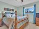 Comfortable bedroom with natural light, perfect for relaxation at 811 Helmsman Way, Palm Harbor, FL 34685