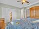 Serene bedroom featuring a full bed, closet, and a bathroom at 811 Helmsman Way, Palm Harbor, FL 34685