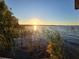 Lake view at sunset with grasses in foreground, a beautiful place for community residents to reflect and relax at 811 Helmsman Way, Palm Harbor, FL 34685