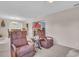 Inviting living room featuring comfortable seating and a view into the adjacent dining area at 811 Helmsman Way, Palm Harbor, FL 34685