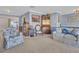 Cozy living room with carpet flooring, seating area, and traditional furnishings at 811 Helmsman Way, Palm Harbor, FL 34685