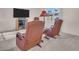 Relaxing living room with comfortable recliners, a lamp, and a flatscreen TV at 811 Helmsman Way, Palm Harbor, FL 34685