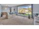 Bright living room with large windows offering plenty of natural light at 811 Helmsman Way, Palm Harbor, FL 34685