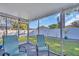 Relaxing screened patio overlooking the backyard at 811 Helmsman Way, Palm Harbor, FL 34685