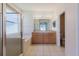 Bathroom featuring a dual sink vanity, soaking tub and glass enclosed shower at 8329 Moccasin Trail Dr, Riverview, FL 33578