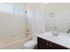 Well-lit bathroom with tub/shower combo, vanity with sink, and a neutral color scheme at 8329 Moccasin Trail Dr, Riverview, FL 33578