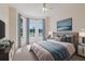 Comfortable bedroom with natural light, plush bedding, and decorative artwork at 8329 Moccasin Trail Dr, Riverview, FL 33578