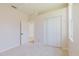 This bedroom features neutral walls, carpet flooring, and a closet for ample storage at 8329 Moccasin Trail Dr, Riverview, FL 33578
