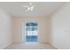 Light-filled bedroom with sliding glass doors to the lanai at 8329 Moccasin Trail Dr, Riverview, FL 33578