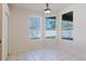 Bright breakfast nook featuring tile floors and bright windows, with a modern light fixture at 8329 Moccasin Trail Dr, Riverview, FL 33578