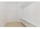 Spacious walk-in closet with carpeted floors and wire shelving, offering ample storage at 8329 Moccasin Trail Dr, Riverview, FL 33578