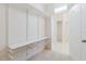 Organized walk-in closet with shelving and access to the bathroom at 8329 Moccasin Trail Dr, Riverview, FL 33578