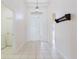 Bright and airy foyer with tile flooring and decorative lighting at 8329 Moccasin Trail Dr, Riverview, FL 33578