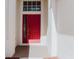 Inviting front entrance featuring a red door at 8329 Moccasin Trail Dr, Riverview, FL 33578