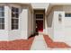Inviting front entrance featuring a red door at 8329 Moccasin Trail Dr, Riverview, FL 33578