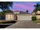 Charming single-Gathering home showcasing a two-car garage and manicured lawn at 8329 Moccasin Trail Dr, Riverview, FL 33578