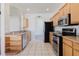 Bright kitchen features stainless steel appliances and light colored cabinets with an open archway design at 8329 Moccasin Trail Dr, Riverview, FL 33578