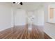 Spacious living room with wood floors and arched entryways, providing a bright and open feel at 8329 Moccasin Trail Dr, Riverview, FL 33578