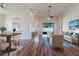 Bright living room with wood floors, modern furnishings, and seamless access to the outdoor area at 8329 Moccasin Trail Dr, Riverview, FL 33578