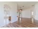 Open-concept living area with wood floors and arched entryways to adjacent rooms at 8329 Moccasin Trail Dr, Riverview, FL 33578
