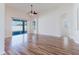 Spacious living room with wood flooring and sliding glass doors leading to the backyard at 8329 Moccasin Trail Dr, Riverview, FL 33578
