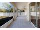 Enclosed patio features sliding glass doors, large windows, and ceiling fan at 8329 Moccasin Trail Dr, Riverview, FL 33578