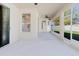 Covered patio features windows and sliding doors to home and yard at 8329 Moccasin Trail Dr, Riverview, FL 33578