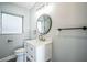 Stylish bathroom with a sleek vanity, elegant mirror, and modern fixtures at 101 Sunlit Cove Ne Dr, St Petersburg, FL 33702