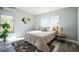 This cozy bedroom is bright and airy, showcasing stylish decor and natural light with modern accents at 101 Sunlit Cove Ne Dr, St Petersburg, FL 33702