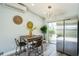 Cozy dining area featuring modern lighting, stainless steel appliances, and a view of the outdoors at 101 Sunlit Cove Ne Dr, St Petersburg, FL 33702