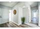 Inviting entryway with wood-look floors, fresh paint, and natural light welcomes you home at 101 Sunlit Cove Ne Dr, St Petersburg, FL 33702