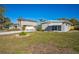 This home features a spacious yard and a charming exterior with a fenced-in area for added privacy and security at 101 Sunlit Cove Ne Dr, St Petersburg, FL 33702