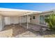 Side exterior shot of a home with a carport and gravel landscaping at 101 Sunlit Cove Ne Dr, St Petersburg, FL 33702