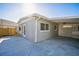 Exterior shot of a home with a carport and concrete patio at 101 Sunlit Cove Ne Dr, St Petersburg, FL 33702