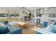 Bright living room with an open floor plan, modern decor, and abundant natural light showcasing a stylish and inviting space at 101 Sunlit Cove Ne Dr, St Petersburg, FL 33702