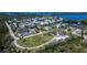 Aerial shot of property offering a circular driveway with lush and mature trees at 1019 Canal St, Ruskin, FL 33570