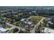 Expansive aerial view capturing the property nestled within lush greenery, near lakes and a serene residential area at 1019 Canal St, Ruskin, FL 33570